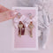 <09003>White ribbon and heart key Earrings