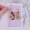 <09060>A bear floating with a red heart Clip-On Earrings