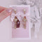 <09067>White ribbon and heart key Clip-On Earrings