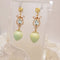 <10081>strawberry rose earrings crystal charm (light blue)