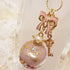 <10088>clown macron rabbit key charm gold print(pink)
