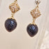 <10098>dark strawberry cross charm earrings