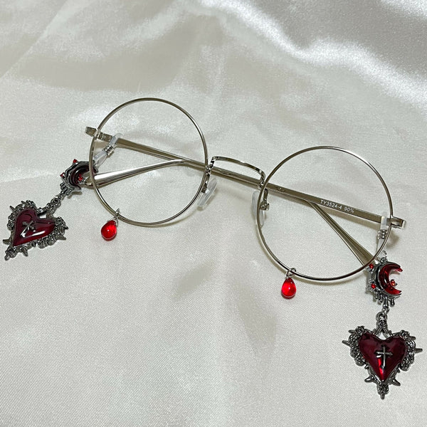 赤い涙と滴る月と茨の心の丸メガネ